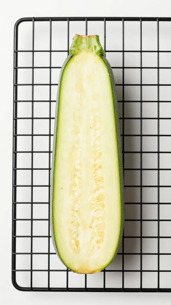 single zucchini chip on cooling rack, studio lighting