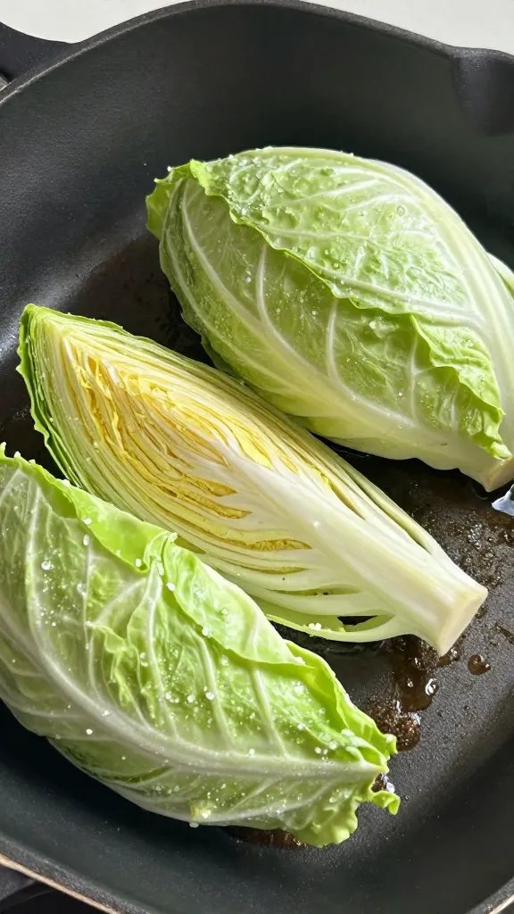 cabbage wedge salted before roasting on hot pan