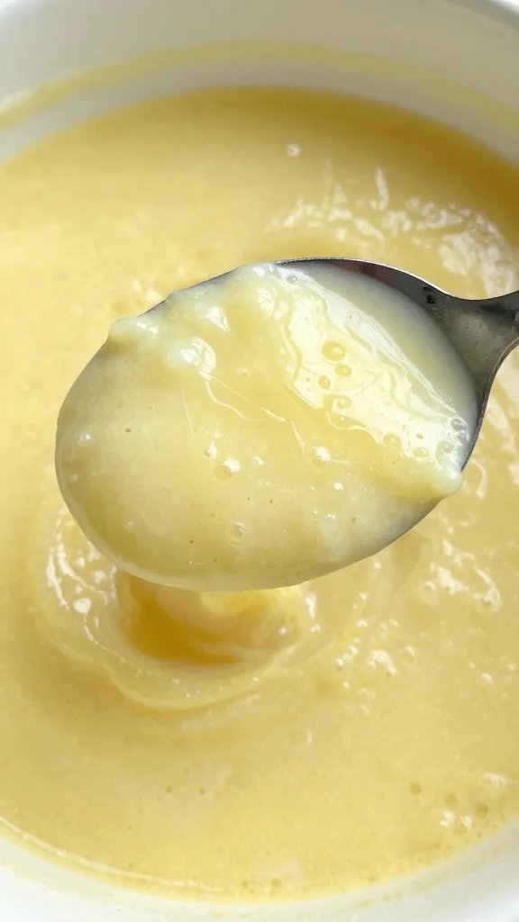 closeup of mayo-lemon mixture spooned onto filling